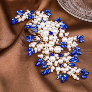Elegant bridal hair comb with gold wire, white pearls, and blue marquise rhinestones