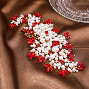 Elegant bridal hair comb with red rhinestones and white pearls on a gold wire base