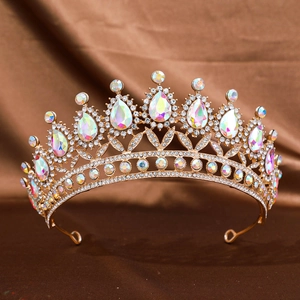 Detail of luxury gold bridal tiara with AB rhinestones on premium brown satin background