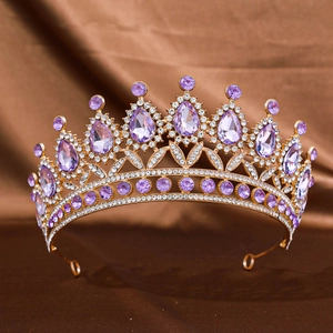 Macro view of purple teardrop crystal embellishments on the gold alloy wedding tiara