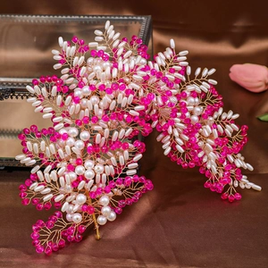 Exquisite floral bridal headpiece with pink crystals and pearls on gold wire frame