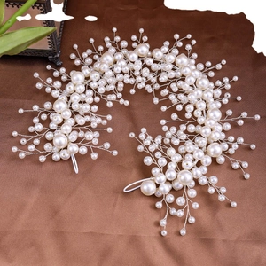 Handmade bridal headband crafted with layered white faux pearls and intricate silver wires
