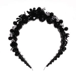 Luxurious black woven crystal headband featuring sequins and multifaceted beads on white background