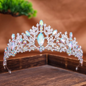 Macro detail of luxury bridal crown with rainbow AB rhinestones on a silver metal frame
