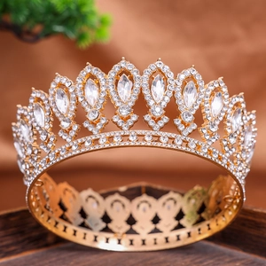 Luxurious baroque gold bridal crown with shimmering crystals and elegant hollow metalwork