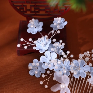 Handmade bridal hair comb with light blue fabric flowers and pearls on silver wire