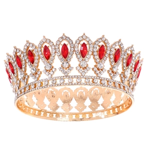 Luxurious baroque gold bridal crown with sparkling white rhinestones and red gems