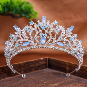 Detailed macro view of silver bridal tiara with light blue crystals and white rhinestones