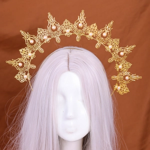 Golden Baroque halo headband with pearls on mannequin for vintage party styling