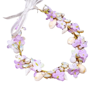 Handmade bridal shell headband with purple fabric flowers and elegant white pearls