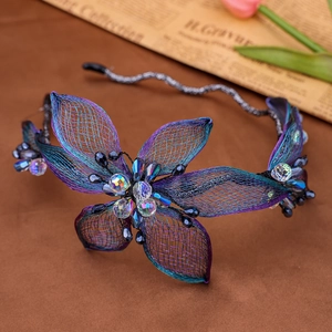 Detail of blue gradient wire mesh flowers and sparkling crystals on bridal hair vine