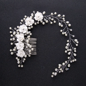 Handmade bridal hair comb with white ceramic flowers, pearls and silver beads decoration