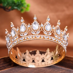 Macro detail of a vintage golden wedding crown with teardrop rhinestones and crystals
