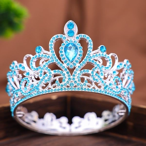 Corona barocca argentata con strass azzurri e gemma a forma di goccia per la sposa