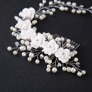 Handmade bridal hair comb with white resin flowers, pearls and crystals on silver wire