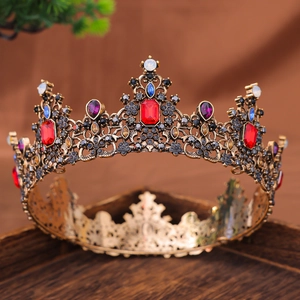 Detailed close-up of a vintage baroque crown featuring colorful rhinestones and bronze alloy