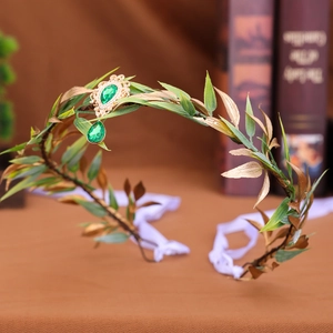 Vintage green leaf tiara with golden accents and emerald crystal teardrop pendant