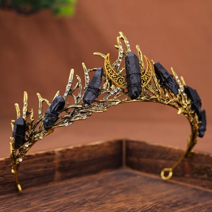 Baroque gothic gold crown with natural black stones and moon detail on wood tray