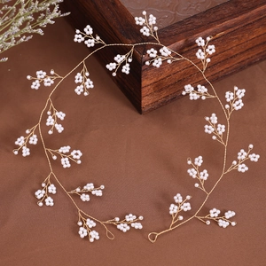 Elegant gold bridal hair vine with white pearls for weddings and formal evening hairstyles