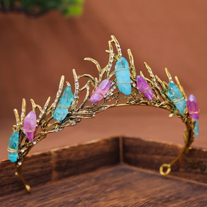 Detail of handmade baroque crown with natural raw stones and gold branch metalwork