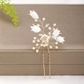 Elegant gold bridal hair comb with white lily of the valley flowers and pearls