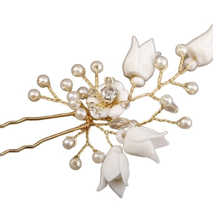 Elegant gold bridal hair comb with white lily of the valley flowers and pearls