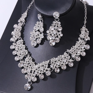 Elegant bridal jewelry set with silver floral necklace and teardrop earrings