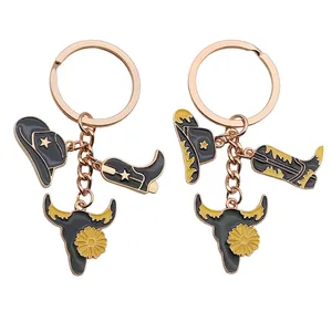 Western style keychain set with black oil drip cowboy hat boot and bull skull charms