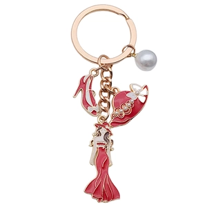 Elegant red enamel dress high heels and hat keychain with pearl in rose gold finish