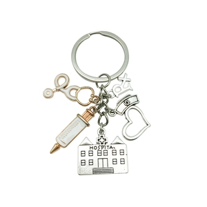 Antique silver medical keychain with stethoscope, syringe, and hospital pendants