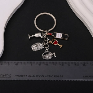 Creative wine themed keychain with Lafite bottle and barrel charms on black background