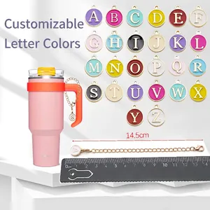 Pink insulated tumbler with 26 colorful enamel alphabet charm chains and lobster clasps
