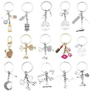 Set of 15 vintage silver alloy keychains with diverse animal and lifestyle charms
