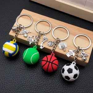 Detailed shot of sports-themed keychains featuring mini volleyball, tennis, and soccer balls