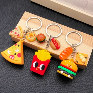 Detail of creative cartoon fast food keychains featuring soft PVC pizza and burgers