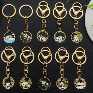 Cartoon panda metal keychains with gold plating and colorful enamel designs on black leather