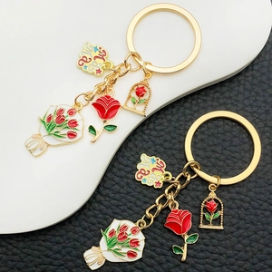 Floral Mama keychain set with red tulips and rose charms in gold plated enamel finish