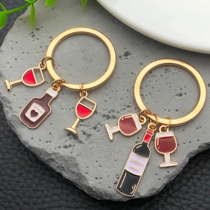 Creative gold wine bottle and glass keychain set with red enamel drip finish