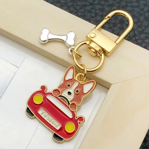 Cute Corgi driving a red car enamel keychain with golden metal ring and bone pendant