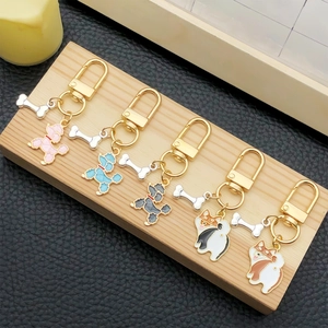 Porte-clés mignons chien Corgi et Caniche en émail avec pendentifs en os dorés