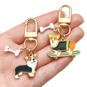 Cartoon Corgi enamel dog keychain set with skateboard design and golden U-shaped ring