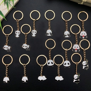 Collection of 15 cute panda keychains in gold metal and black white enamel designs
