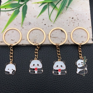Cute cartoon panda keychains set with golden metal finish and heart charms