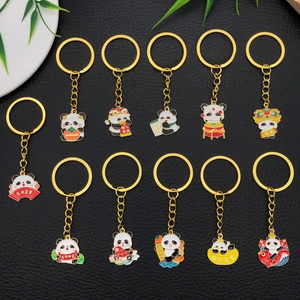 Creative panda keychain set with 11 pieces featuring enamel koi and lion dance charms