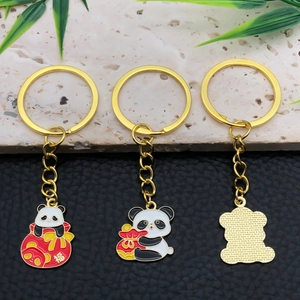 Macro detail of Chinese panda keychains showing oil-drop enamel finish and back texture
