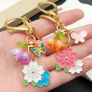 Acrylic butterfly and lily of the valley flower keychain with gold lobster clasp