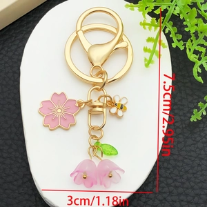 Pink cherry blossom and lily of the valley keychain with gold bee charm for bags