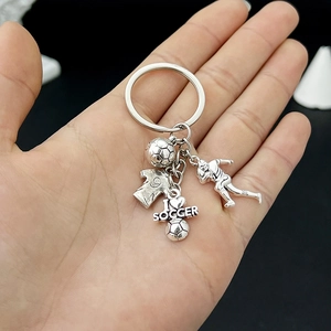 Detail of soccer keychain with ball, jersey number 9, and I Love Soccer heart charm