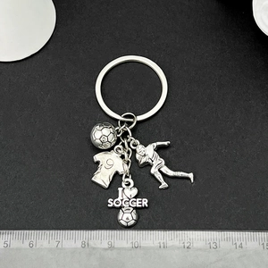 Silver metal football keychain with jersey and player pendant for sports fans