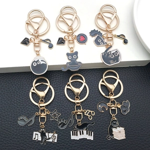 Set of 6 cute black cat enamel keychains with golden zinc alloy rings and music motifs